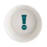 A perfectly round white ceramic bowl with a blue and white logo in the center, minimalistic design, functional kitchenware.